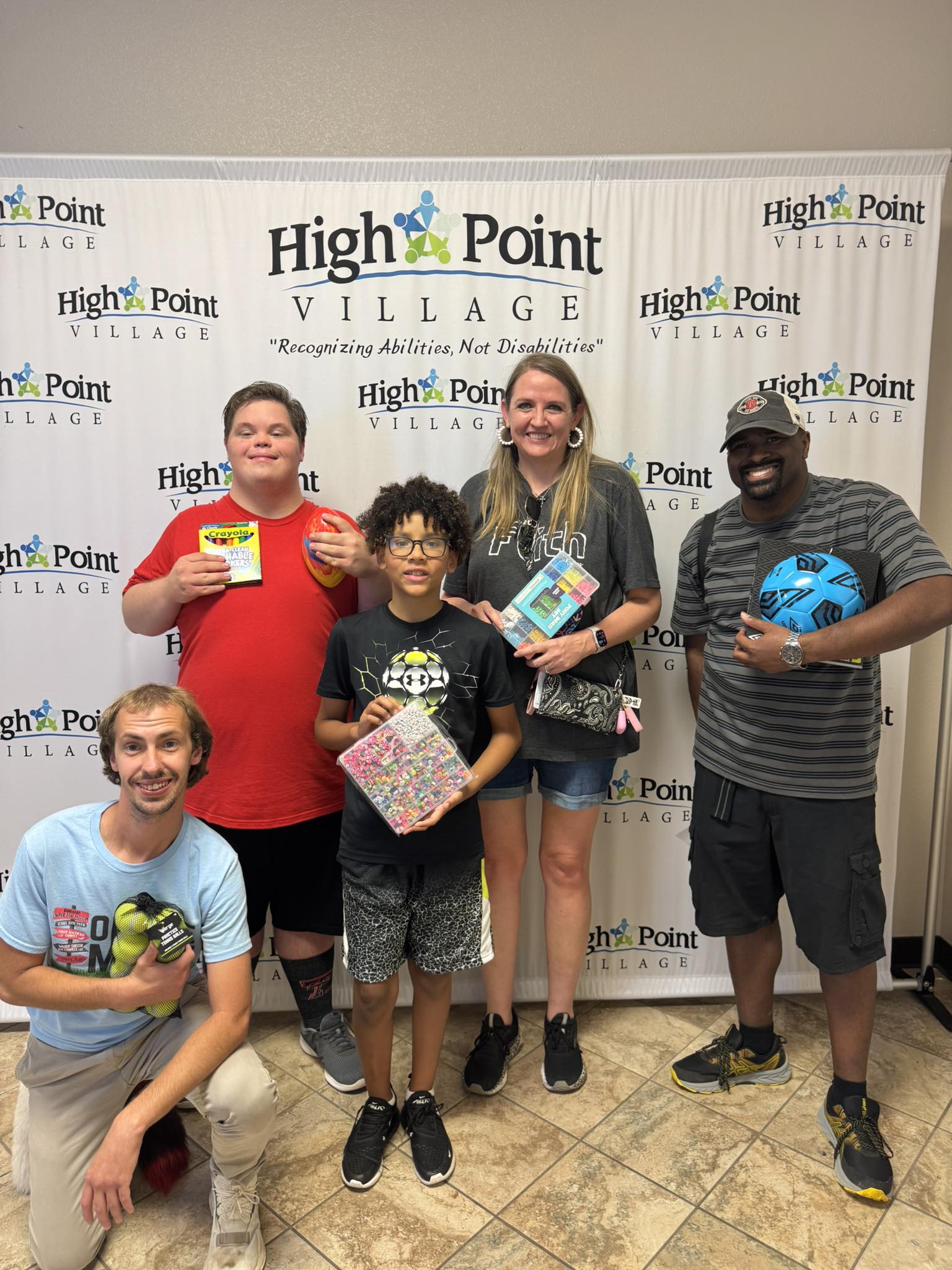 group of people sitting on ground with bonfire